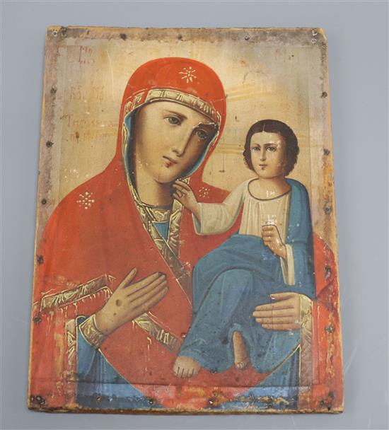 A 19th century Russian painted wood icon 28 x 21cm